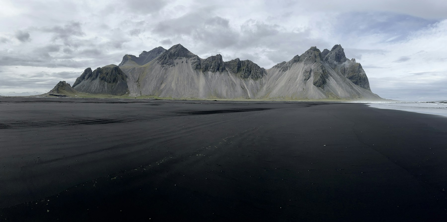 Vestrahorn mountains above a black sand beach in Iceland